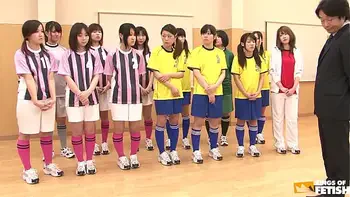 Japanese female team listen and take a lesson from their coach