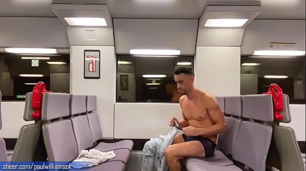 Sexy tanned man travelling naked by train. Very risky public nudity