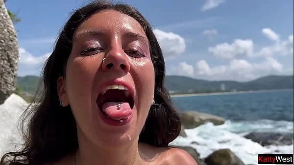 Golden shower on the face of a wet brunette and hot sex on a public beach