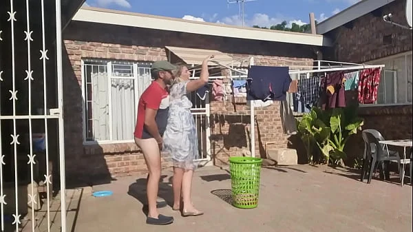 Outdoor fucking while taking off the laundry