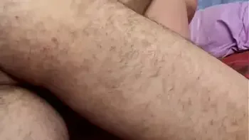 A mature woman over 60 gives a blowjob to an inexperienced young man