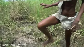 Skinny African tribe woman working outdoor