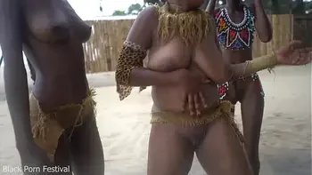 3 African tribe witches doing a dancing ritual for making rain
