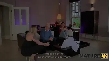 MATURE4K. April Velvet used her amazing tits to milk her neighbour's big cock, while husband was sitting next door