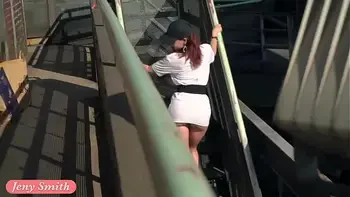 Jeny Smith is walking naked through an abandoned factory.