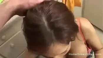 Busty brunette MILF sucking her neighbors big cock