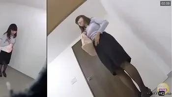 Office Lady wetting herself in the bathroom