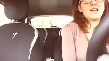 Nicoletta takes a ride in the car masturbates and fills her hands with squirting as she comes