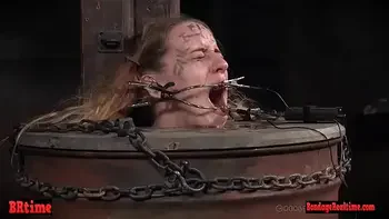 Bdsm babe trapped in a barrel and electrified