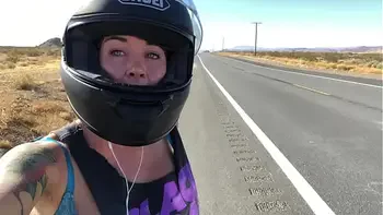 felicity feline riding on aprilia tuono motorcycle