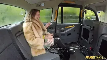 Fake Taxi Ava Austen rides a big black dildo on the backseat