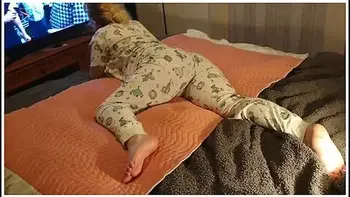 Cute Lazy Girl Wets Her Pyjamas Watching Tv Lying On Her Tummy!