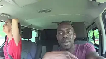 a young girl sucks a big black cock in a car park in the street in the middle of the afternoon.part1