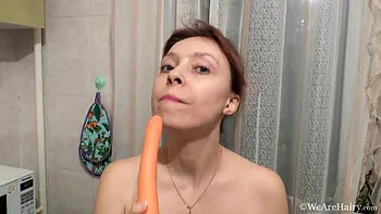 Trixie masturbates in her kitchen with a carrot - WeAreHairy