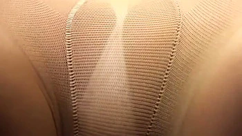 He puts his hand in and fingers her, then rips her pantyhose and uses it for a footjob.