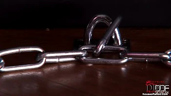 Bound latex-wearing Bailey peeing