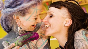 Anuskatzz in wild lesbian fisting action with her bald, tattooed, pierced partner