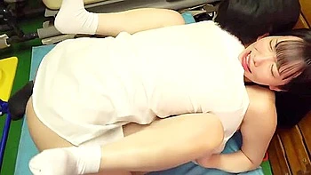 Her body is touched, her nipples are licked, and a fingering vibrator is inserted and fucked.