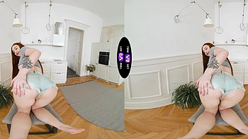 A sexy girl with long hair plays with her pussy in shorts