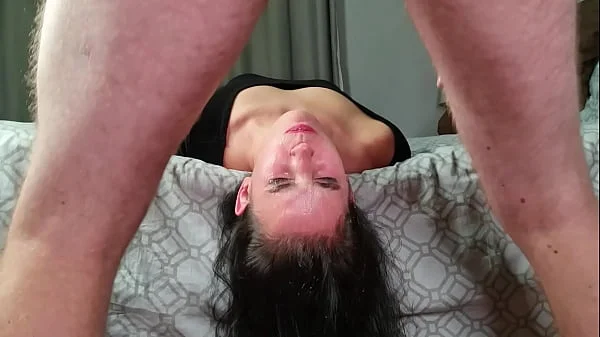 Pissing down a thirsty dirty slut's throat just for her to swallow while laying upside down from the bed