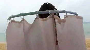 She gets touched by two men and they thrust deep into her throat and cum in her mouth.