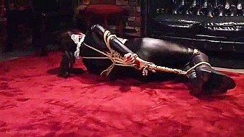 A toy is inserted into her anus and thrust in and out of both holes at the same time.