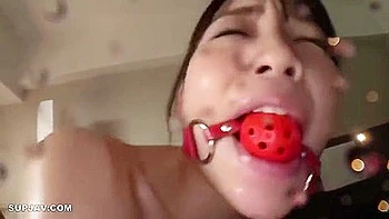 She applies lotion, thrusts the vibrator in and out, and then rides it in the cowgirl position, making her squirt.