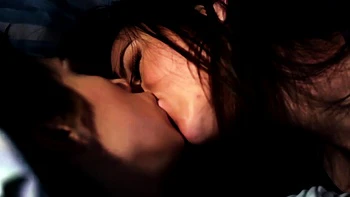 Brunette lesbian babes fingering on a couch