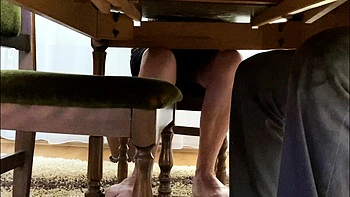 My mother in law spreads her legs under the desk