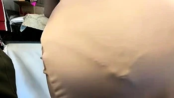 Brunette seductress working her big boobs and hot ass