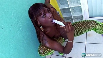 Ebony in green fishnet Kali Dreams touches her wet shaved pussy