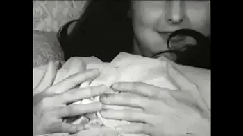 Watch young vintage brunette with round melons masturbate in old porn movie