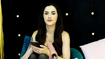 Sexy brunette babe in lingerie and stockings toys pussy