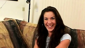 Pink labia close up of naive brunette playing with her name