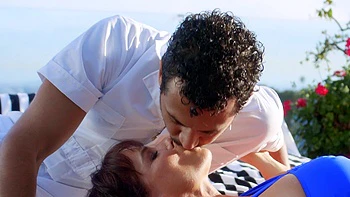 Brunette with long hair fucks in a bikini with a big black cock