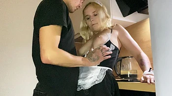 The couple has a hot sex in the kitchen while the maid is busy with a Lolipop.